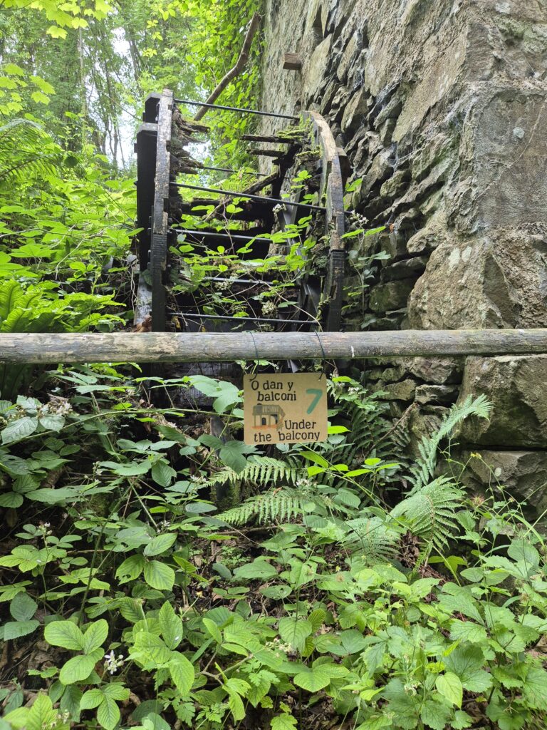 Sign 7, under the balcony